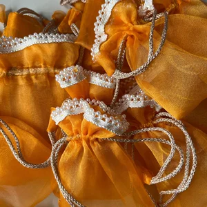 Vibrant Orange Pearl Potli Bag